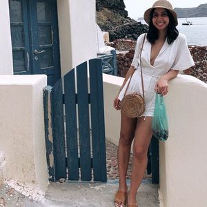 White jumpsuit with collar and tie belt